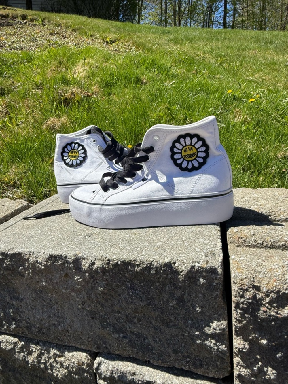 DC White High-Top Platform Sneakers with Black Laces and Yellow Daisy Patch